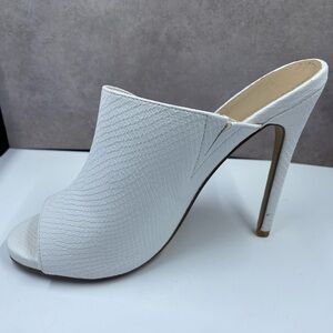White slip on heeled sandal.